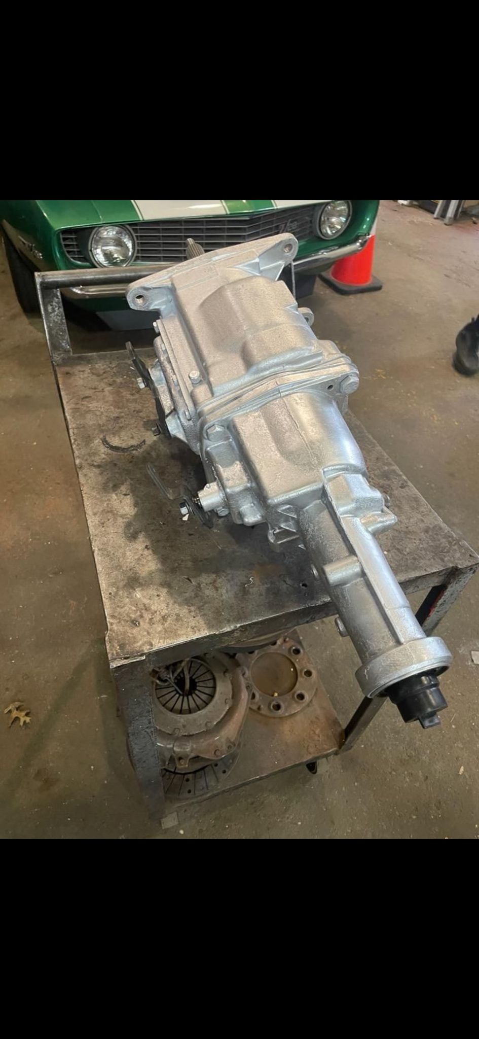 Transmission housings stacked with parts behind them